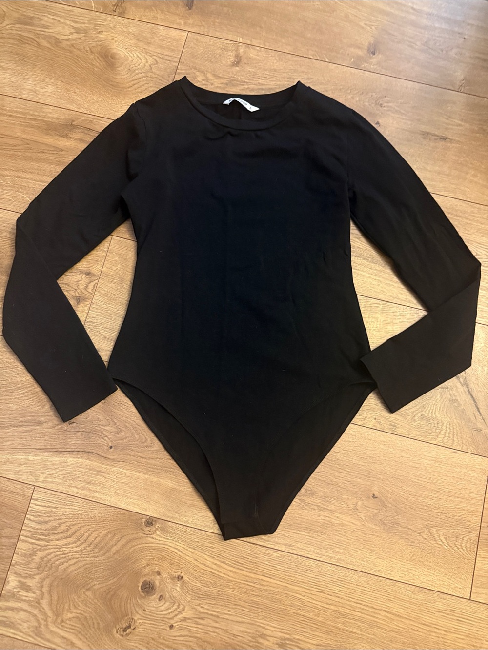Mango brand Black Long-Sleeve body suit. Listed as a small but almost a medium.